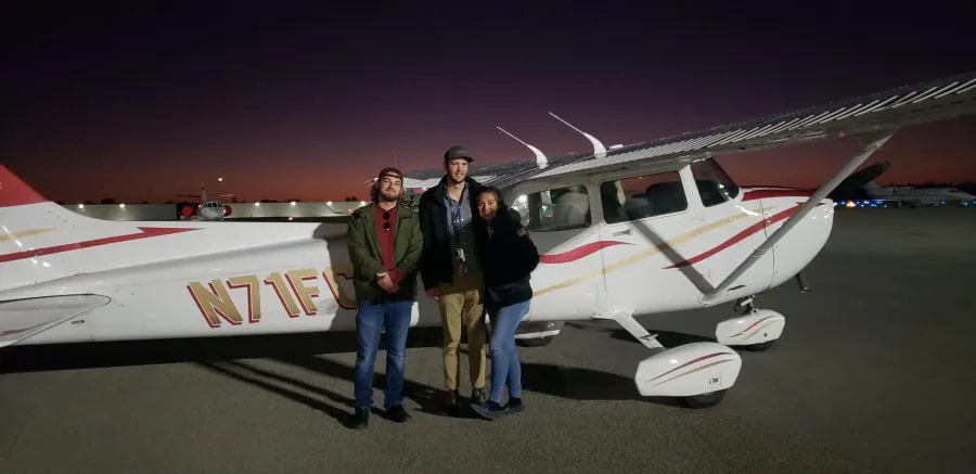 FAST aerial survey team stands beside their Cessna 172 (tail N71FC) at sunset, highlighting aviation-grade mapping and drone data expertise.