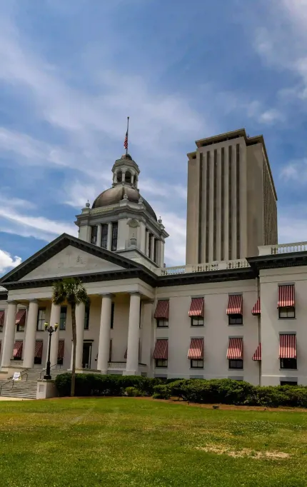 Top-down image of a construction site in Tallahassee with fresh concrete being poured and visible rebar grid